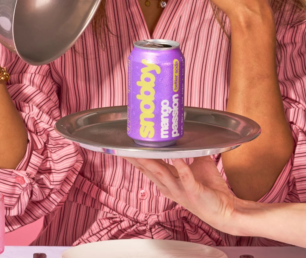 snobby mango passion can served on a silver tray